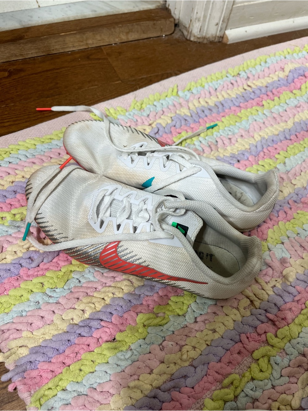 Nike White Track and Field Spikes with Coral Swoosh and Teal Accents